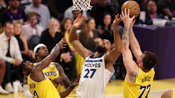 Los Angeles Lakers guard Luka Doncic rebounds a ball against Minnesota Timberwolves center Rudy Gobert (27) during the first quarter of Game 2 of their first-round playoff series at Crypto.com Arena in Los Angeles on April 22, 2025.