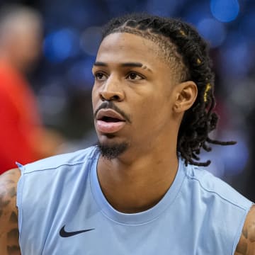 Dec 23, 2023; Atlanta, Georgia, USA; Memphis Grizzlies guard Ja Morant (12) warms up on the court prior to the game against the Atlanta Hawks at State Farm Arena. 