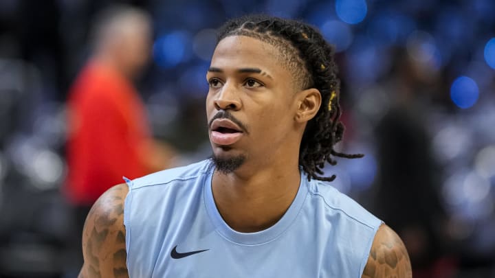 Dec 23, 2023; Atlanta, Georgia, USA; Memphis Grizzlies guard Ja Morant (12) warms up on the court prior to the game against the Atlanta Hawks at State Farm Arena. 