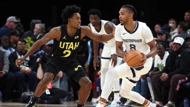 Nov 29, 2023; Memphis, Tennessee, USA; Memphis Grizzlies forward Ziaire Williams (8) controls the ball as Utah Jazz guard Collin Sexton (2) defends during the second half at FedExForum. Mandatory Credit: Petre Thomas-USA TODAY Sports