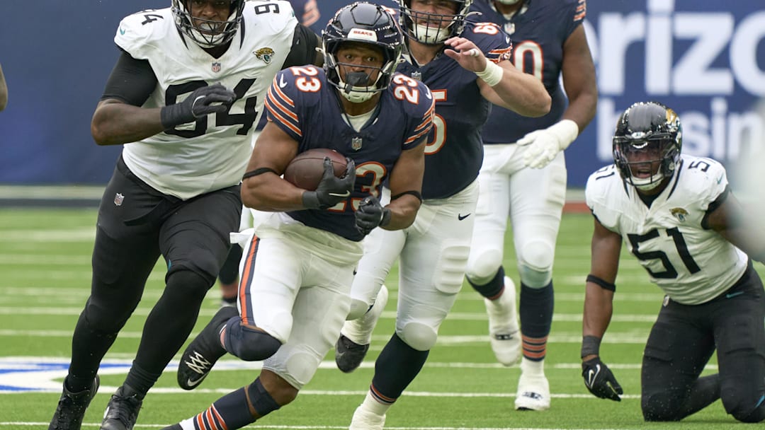 Oct 13, 2024; London, United Kingdom; Chicago Bears running back Roschon Johnson (23) carries the ball during the first half of an NFL International Series game at Tottenham Hotspur Stadium. Mandatory Credit: Peter van den Berg-Imagn Images