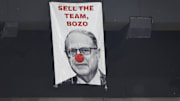 May 23, 2024; Chicago, Illinois, USA; Fans put out a sign sign portraying Chicago White Sox chairman Jerry Reinsdorf as Bozo the Clown during the eighth inning against the Baltimore Orioles at Guaranteed Rate Field. Mandatory Credit: Kamil Krzaczynski-Imagn Images