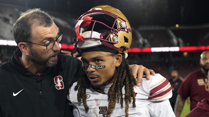 Sep 13, 2025; Stanford, California, USA; Stanford Cardinal general manager Andrew Luck (left) greets Boston College Eagles wide receiver Lewis Bond (11) after the game at Stanford Stadium. Mandatory Credit: Darren Yamashita-Imagn Images
