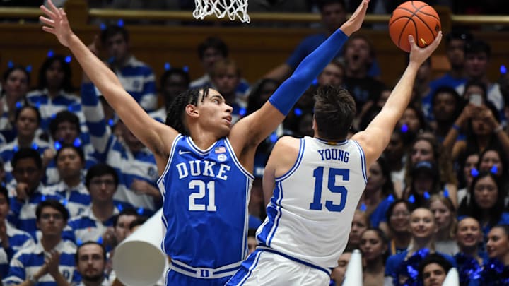 Oct 21, 2022; Durham, North Carolina, US; Duke Blue Devils center Ryan Young (15) shoots over Duke Blue Devils center Christian Reeves (21) during Countdown to Craziness at Cameron Indoor Stadium. Mandatory Credit: Rob Kinnan-Imagn Images