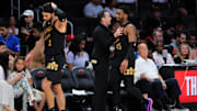 Apr 26, 2025; Miami, Florida, USA; Cleveland Cavaliers guard Donovan Mitchell (45) celebrates with head coach Kenny Atkinson in the fourth quarter against the Miami Heat during game three for the first round of the 2025 NBA Playoffs at Kaseya Center. Mandatory Credit: Sam Navarro-Imagn Images