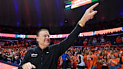 Nov 14, 2025; Champaign, Illinois, USA;  Illinois Fighting Illini head coach Brad Underwood greets the crowd before the tip of the game with the Colgate Raiders  at State Farm Center. Mandatory Credit: Ron Johnson-Imagn Images