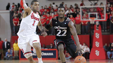 Jan 22, 2011; Jamaica, NY, USA;   Cincinnati Bearcats forward Rashad Bishop (22) drives the lane as St. John's Red Storm guard/forward D.J. Kennedy (1) defends during the first half at Carnesecca Arena.  Mandatory Credit: Anthony Gruppuso-Imagn Images