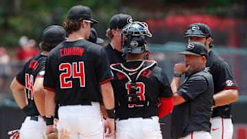 Georgia baseball coach Wes Johnson huddles up his team during a NCAA Athens Regional baseball game against Army in Athens, Ga., on Friday, May 31, 2024.