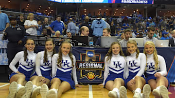 Mar 26, 2017; Memphis, TN, USA; Kentucky Wildcats cheerleaders pose by the Regional logo before the first half of a game against the North Carolina Tar Heels during the finals of the South Regional of the 2017 NCAA Tournament at FedExForum. Mandatory Credit: Justin Ford-Imagn Images