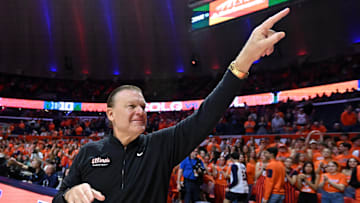 Nov 14, 2025; Champaign, Illinois, USA;  Illinois Fighting Illini head coach Brad Underwood greets the crowd before the tip of the game with the Colgate Raiders  at State Farm Center. Mandatory Credit: Ron Johnson-Imagn Images