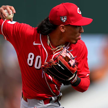 Cincinnati Reds shortstop Edwin Arroyo fields a groundball in the fifth inning during a MLB spring training baseball game, Saturday, Feb. 24, 2024, at Goodyear Ballpark in Goodyear, Ariz.