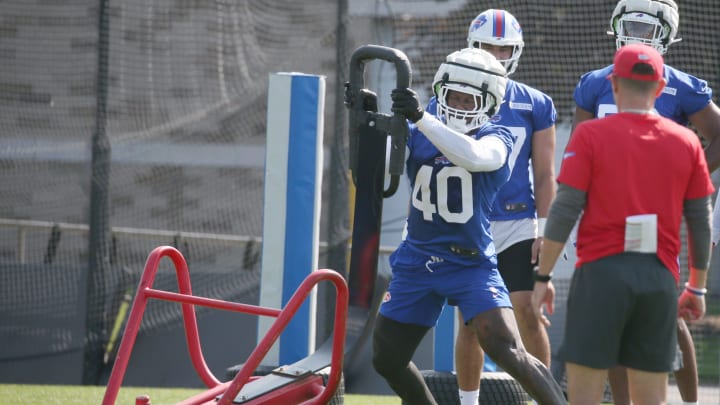 Bills edge Von Miller throws aside a blocking sled during drills.