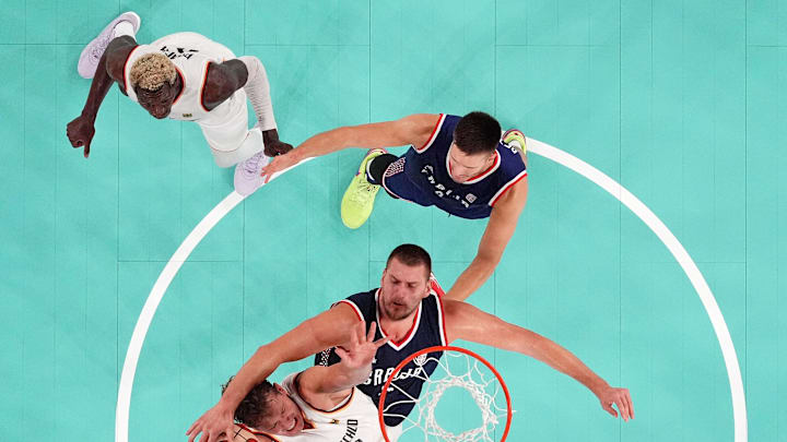 Aug 10, 2024; Paris, France; Serbia power forward Nikola Jokic (15) blocks the shot of Germany forward Moritz Wagner (13) in the men's basketball bronze medal game during the Paris 2024 Olympic Summer Games at Accor Arena. Mandatory Credit: Kyle Terada-Imagn Images