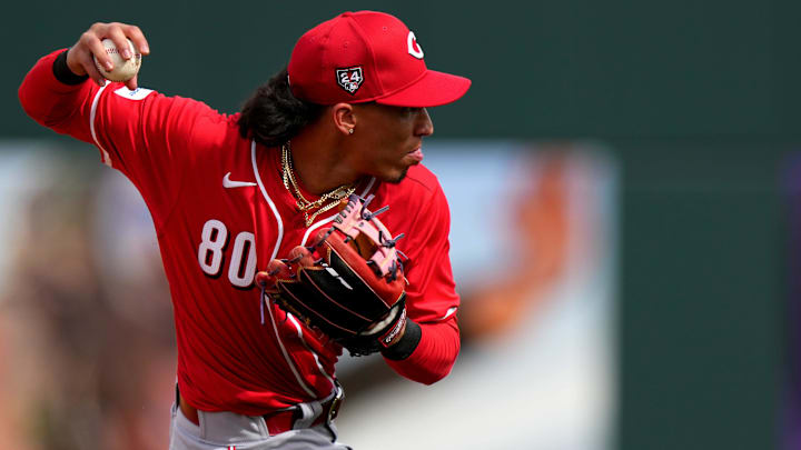 Cincinnati Reds shortstop Edwin Arroyo fields a groundball in the fifth inning during a MLB spring training baseball game, Saturday, Feb. 24, 2024, at Goodyear Ballpark in Goodyear, Ariz.