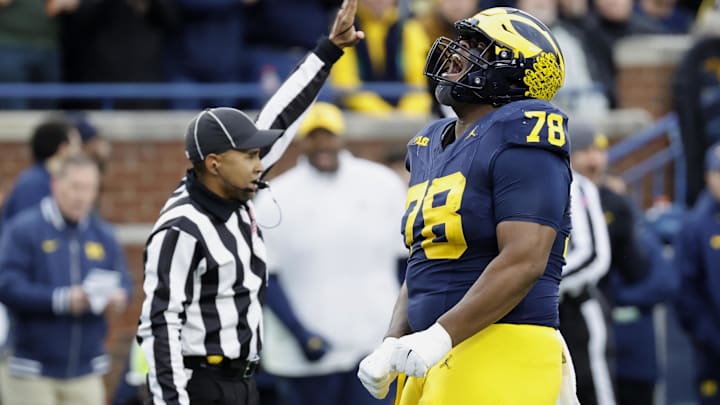 Nov 23, 2024; Ann Arbor, Michigan, USA;  Michigan Wolverines defensive lineman Kenneth Grant (78) celebrates after sacking Northwestern Wildcats quarterback Jack Lausch (not pictured) in the first half at Michigan Stadium. Mandatory Credit: Rick Osentoski-Imagn Images