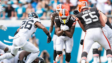 Sep 15, 2024; Jacksonville, Florida, USA; Cleveland Browns running back D'Onta Foreman (27) runs against Jacksonville Jaguars safety Antonio Johnson (26) in the fourth quarter at EverBank Stadium.