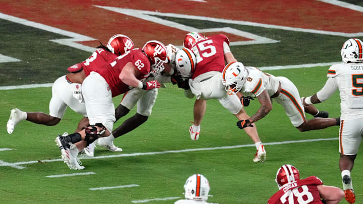 Jan 19, 2026; Miami Gardens, FL, USA; Indiana Hoosiers quarterback Fernando Mendoza (15) runs with the ball for a touchdown against the Miami Hurricanes during the second half of the College Football Playoff National Championship game at Hard Rock Stadium. Mandatory Credit: James Lang-Imagn Images