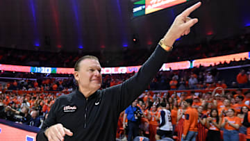 Nov 14, 2025; Champaign, Illinois, USA;  Illinois Fighting Illini head coach Brad Underwood greets the crowd before the tip of the game with the Colgate Raiders  at State Farm Center. Mandatory Credit: Ron Johnson-Imagn Images