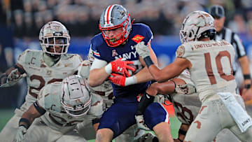Dec 11, 2021; East Rutherford, New Jersey, USA; Navy Midshipmen fullback Isaac Ruoss (32) carries the ball against the Army Black Knights during the second half of the 122nd Army-Navy game.
