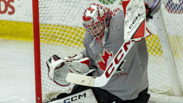 Aug 3, 2024; Plymouth, MI, USA; Canada's goaltender Joshua Ravensbergen (31) reacts to a shot against USA during the second period of the 2024 World Junior Summer Showcase at USA Hockey Arena. Mandatory Credit: David Reginek-Imagn Images