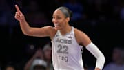 Sep 11, 2025; Los Angeles, California, USA; Las Vegas Aces center A'ja Wilson (22) celebrates after a 3 pointer  during the second half against the Los Angeles Sparks at Crypto.com Arena. Mandatory Credit: Jayne Kamin-Oncea-Imagn Images