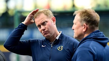 Oct 2, 2024; Milwaukee, Wisconsin, USA; Milwaukee Brewers general manager Matt Arnold talks to manager Pat Murphy before game two of the Wildcard round for the 2024 MLB Playoffs against the New York Mets at American Family Field. Mandatory Credit: Benny Sieu-Imagn Images