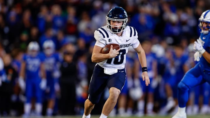 Sep 15, 2023; Colorado Springs, Colorado, USA; Utah State Aggies quarterback McCae Hillstead (10) runs the ball in the second quarter against the Air Force Falcons at Falcon Stadium. Mandatory Credit: Isaiah J. Downing-USA TODAY Sports