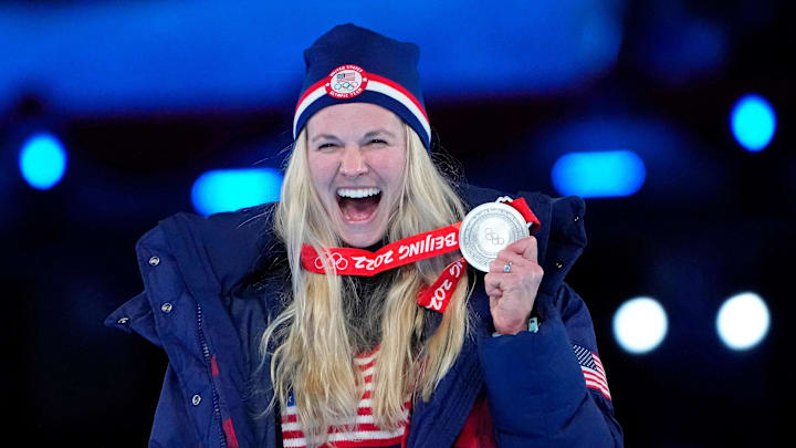 Jessie Diggins celebrates her silver medal in cross-country skiing women's 30km mass start during the closing ceremony for the Beijing 2022 Olympic Winter Games. She attended Stillwater Area High School. 