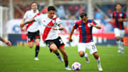 Enzo Perez (L) of River Plate and Nahuel Barrios (R) of San...