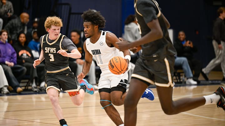 Sierra Canyon's DeLan Grant weaves through St. Francis defenders during a Mission League game.