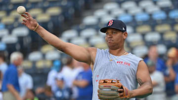 Aug 5, 2024; Kansas City, Missouri, USA;  Boston Red Sox third baseman Rafael Devers (11) warms up before a game against the Kansas City Royals at Kauffman Stadium. Mandatory Credit: Peter Aiken-Imagn Images