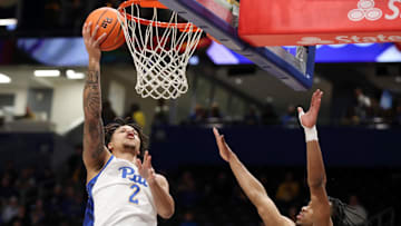 Mar 8, 2025; Pittsburgh, Pennsylvania, USA;  Pittsburgh Panthers forward Cameron Corhen (2) shoots against Boston College Eagles guard Donald Hand Jr. (13) during the first half at the Petersen Events Center. Mandatory Credit: Charles LeClaire-Imagn Images