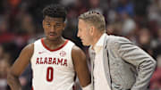 Mar 12, 2023; Nashville, TN, USA;  Alabama Crimson Tide head coach Nate Oats talks with Alabama Crimson Tide guard Jaden Bradley (0) during the second half at Bridgestone Arena. Mandatory Credit: Steve Roberts-Imagn Images