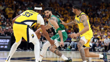 May 25, 2024; Indianapolis, Indiana, USA; Boston Celtics forward Jayson Tatum (middle) controls the ball against Indiana Pacers center Myles Turner (33) and forward Obi Toppin (right) during the fourth quarter of game three of the eastern conference finals in the 2024 NBA playoffs at Gainbridge Fieldhouse. Mandatory Credit: Trevor Ruszkowski-USA TODAY Sports