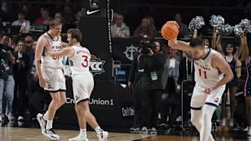 March 12, 2024; Las Vegas, NV, USA; Saint Mary's Gaels guard Luke Barrett (33) and guard Augustas Marciulionis (3) and center Mitchell Saxen (11) celebrate against the Gonzaga Bulldogs after the game in the finals of the WCC Basketball Championship at Orleans Arena. 
