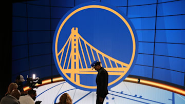Jul 29, 2021; Brooklyn, New York, USA; Moses Moody (Arkansas) walks off the stage after being selected as the number fourteen overall pick by the Golden State Warriors in the first round of the 2021 NBA Draft at Barclays Center. Mandatory Credit: Brad Penner-Imagn Images