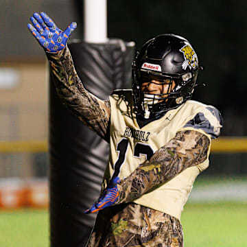 Buchholz Bobcats wide receiver and Florida Gators commit Justin Williams (13) gestures with a Gator Chomp.