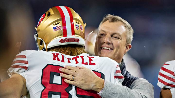 San Francisco 49ers tight end George Kittle (L) and general manager John Lynch (R)