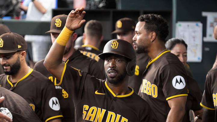 Jun 20, 2026; Arlington, Texas, USA;  San Diego Padres left fielder Samad Taylor (0) is greeted in the dugout after scoring against the Texas Rangers during the eighth inning at Globe Life Field. Mandatory Credit: Raymond Carlin III-Imagn Images