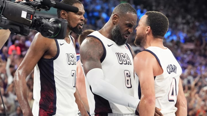 Aug 8, 2024; Paris, France; United States guard Kevin Durant (7), guard LeBron James (6) and shooting guard Stephen Curry (4) celebrate after the game against Serbia in a men's basketball semifinal game during the Paris 2024 Olympic Summer Games at Accor Arena. 