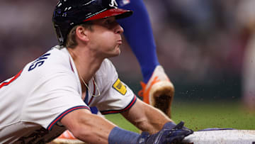 Atlanta Braves shortstop Luke Williams (37) slides safely into third base against the New York Mets in the tenth inning at Truist Park.