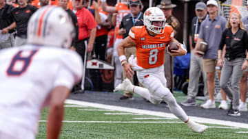 Oklahoma State quarterback Hauss Hejny (8) runs the ball for a touchdown in the first quarter during an NCAA football game between Oklahoma State (OSU) and UT Martin in Stillwater, Okla., on Thursday, Aug. 28, 2025.