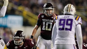 Nov 27, 2021; Baton Rouge, Louisiana, USA;  Texas A&M Aggies quarterback Zach Calzada (10) looks over the LSU Tigers defense during the first half at Tiger Stadium. Mandatory Credit: Stephen Lew-Imagn Images