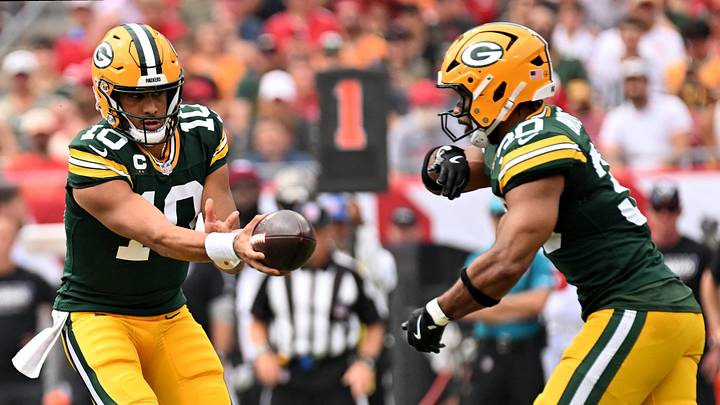 Oct 4, 2026; Tampa, Florida, USA;  Green Bay Packers quarterback Jordan Love (10) hands of the ball to running back Chris Brooks (30) during the first quarter against the Tampa Bay Buccaneers at Raymond James Stadium.  Mandatory Credit: Jonathan Dyer-Imagn Images