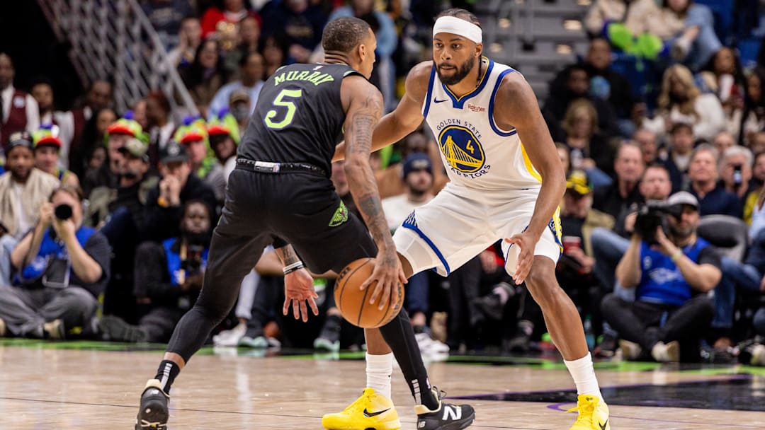 Feb 24, 2026; New Orleans, Louisiana, USA;  New Orleans Pelicans guard Dejounte Murray (5) dribbles against Golden State Warriors guard Moses Moody (4) during the second half at Smoothie King Center. Mandatory Credit: Stephen Lew-Imagn Images