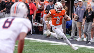Oklahoma State quarterback Hauss Hejny (8) runs the ball for a touchdown in the first quarter during an NCAA football game between Oklahoma State (OSU) and UT Martin in Stillwater, Okla., on Thursday, Aug. 28, 2025.