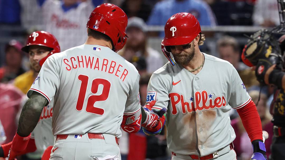 May 15, 2026; Pittsburgh, Pennsylvania, USA;  Philadelphia Phillies first baseman Bryce Harper (right) greets designated hitter Kyle Schwarber (12) crossing home plate on a two-run home run which was his second home run of the game during the seventh inning against the Pittsburgh Pirates at PNC Park. 