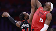Dec 12, 2024; Miami, Florida, USA;  Toronto Raptors forward Bruno Fernando (24) and Miami Heat center Bam Adebayo (13) tip off during the first half at Kaseya Center. Mandatory Credit: Rhona Wise-Imagn Images