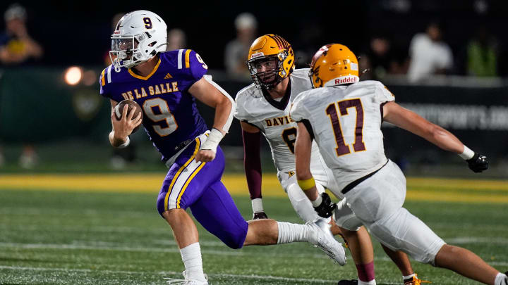 Warren De La Salle quarterback Anthony Bitonti runs against Davison during second half of Prep Kickoff Classic at Wayne State's Tom Adams Field in Detroit on Thursday, August 29, 2024.