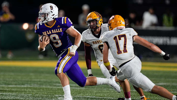 Warren De La Salle quarterback Anthony Bitonti runs against Davison during second half of Prep Kickoff Classic at Wayne State's Tom Adams Field in Detroit on Thursday, August 29, 2024.